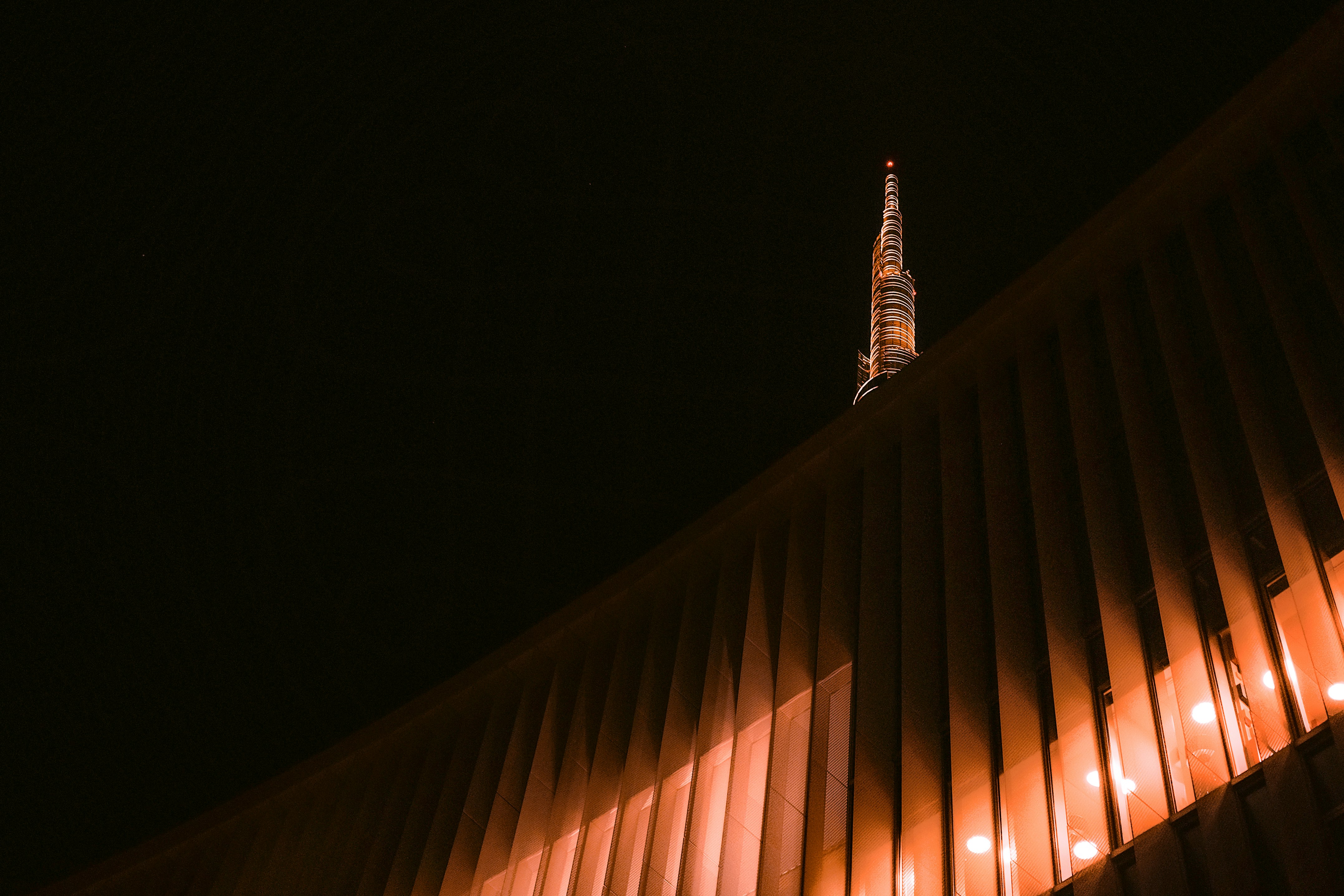 worm's-eye view of tower with orange lights